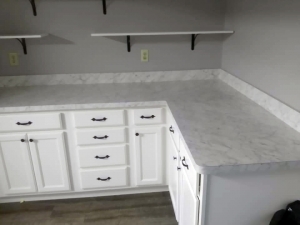 Laminate countertop and cabinets in laundry room